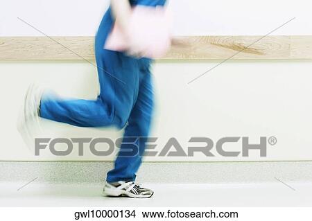 Female nurse running in a hospital View Large Photo Image Picture - Female nurse running in a hospital. Fotosearch