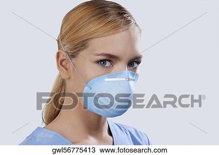 Female nurse wearing a flu mask View Large Photo Image Stock Image - Female nurse wearing a flu mask. Fotosearch