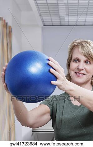 Female patient exercising with a fitness ball View Large Photo Image Picture - Female patient exercising with a fitness ball. Fotosearch