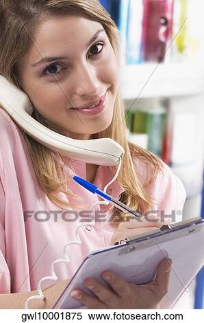 Female pharmacist talking on the telephone View Large Photo Image Stock Photography - Female pharmacist talking on the telephone. Fotosearch