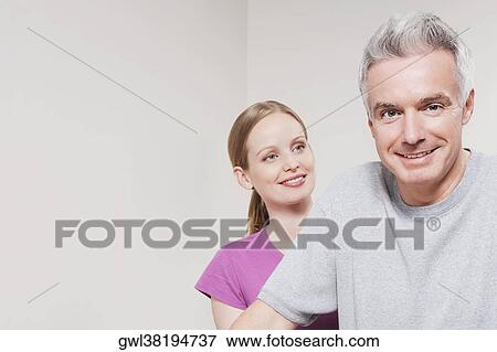 Female physiotherapist smiling with a patient View Large Photo Image Stock Photo - Female physiotherapist smiling with a patient. Fotosearch