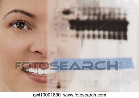 Female scientist examining a report in a laboratory View Large Photo Image Stock Image - Female scientist examining a report in a laboratory. Fotosearch