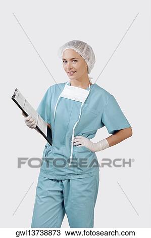 Female surgeon holding a clipboard View Large Photo Image Stock Image - Female surgeon holding a clipboard. Fotosearch