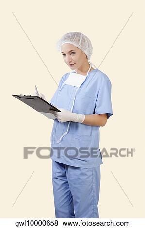 Stock Photo - Female surgeon holding a clipboard. Fotosearch