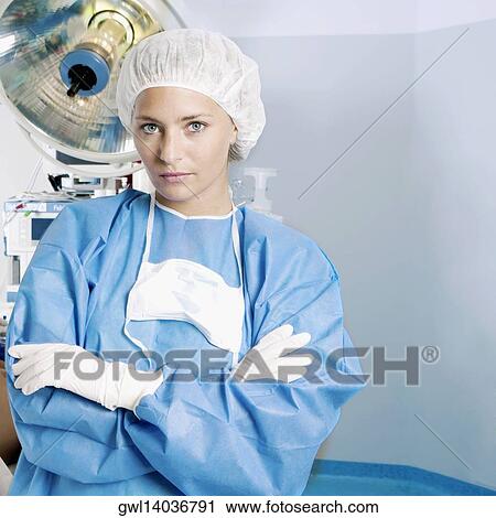 Female surgeon looking serious in an operating room View Large Photo Image Stock Image - Female surgeon looking serious in an operating room. Fotosearch