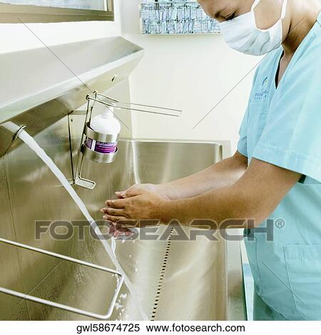 Female surgeon washing hands View Large Photo Image Stock Photography - Female surgeon washing hands. Fotosearch