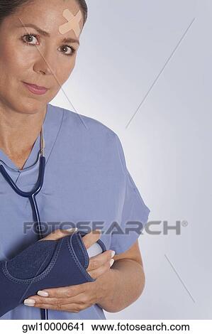 Female surgeon wearing a wrist brace View Large Photo Image Stock Image - Female surgeon wearing a wrist brace. Fotosearch