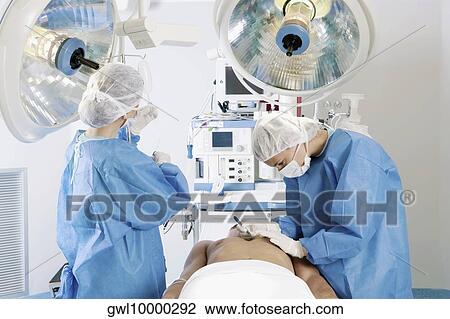 Female surgeons performing surgery View Large Photo Image Stock Image - Female surgeons performing surgery. Fotosearch