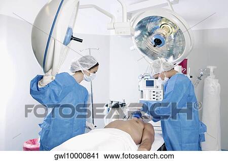 Female surgeons performing surgery View Large Photo Image Stock Image - Female surgeons performing surgery. Fotosearch