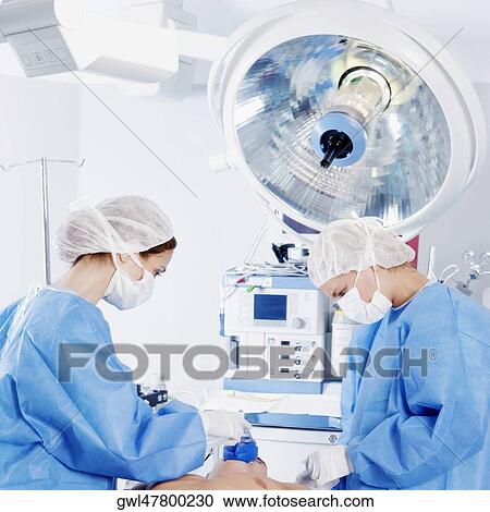 Female surgeons performing surgery View Large Photo Image Stock Image - Female surgeons performing surgery. Fotosearch
