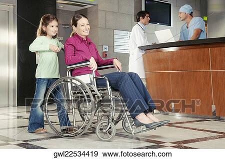 Girl pushing her mother in a wheelchair View Large Photo Image Stock Photo - Girl pushing her mother in a wheelchair. Fotosearch