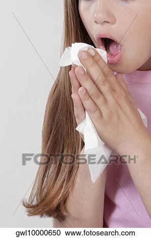 Stock Image - Girl suffering from cold. Fotosearch