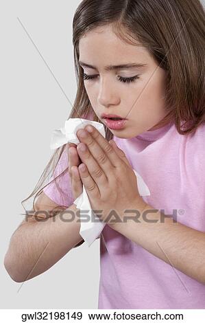 Stock Photo - Girl suffering from cold. Fotosearch