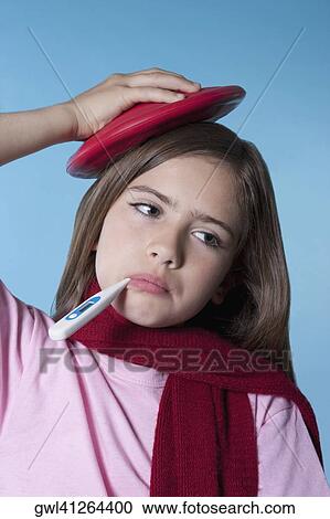 Girl taking her temperature and applying ice pack View Large Photo Image Stock Image - Girl taking her temperature and applying ice pack. Fotosearch