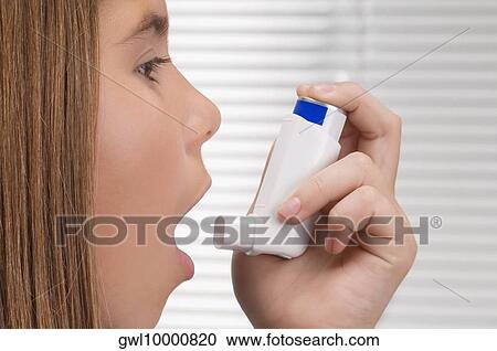 Girl using an asthma inhaler View Large Photo Image Stock Image - Girl using an asthma inhaler. Fotosearch