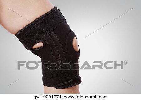 Knee brace on a person's knee View Large Photo Image Picture - Knee brace on a person's knee. Fotosearch