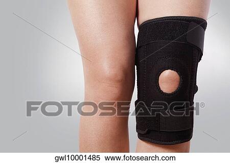 Knee brace on a person's knee View Large Photo Image Stock Photography - Knee brace on a person's knee. Fotosearch