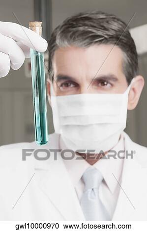 Lab technician analyzing sample in a test tube View Large Photo Image Stock Image - Lab technician analyzing sample in a test tube. Fotosearch