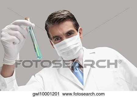 Lab technician analyzing sample in a test tube View Large Photo Image Stock Image - Lab technician analyzing sample in a test tube. Fotosearch