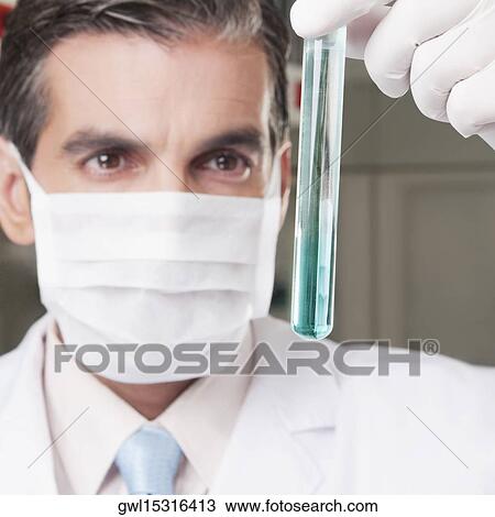 Lab technician analyzing sample in a test tube View Large Photo Image Stock Image - Lab technician analyzing sample in a test tube. Fotosearch