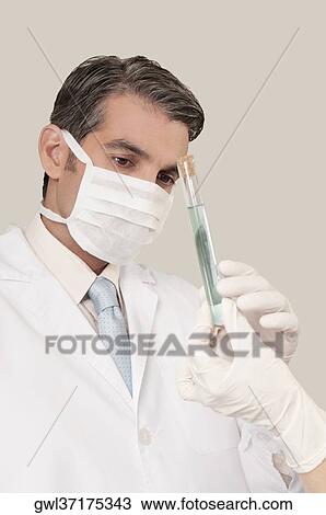 Lab technician analyzing sample in a test tube View Large Photo Image Stock Image - Lab technician analyzing sample in a test tube. Fotosearch
