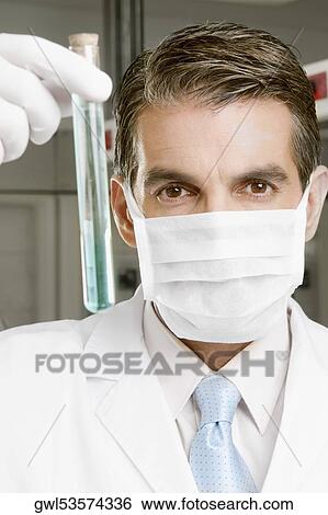 Lab technician analyzing sample in a test tube View Large Photo Image Stock Photograph - Lab technician analyzing sample in a test tube. Fotosearch