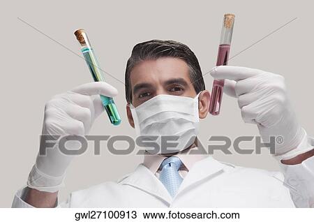 Lab technician analyzing sample in test tubes View Large Photo Image Stock Image - Lab technician analyzing sample in test tubes. Fotosearch