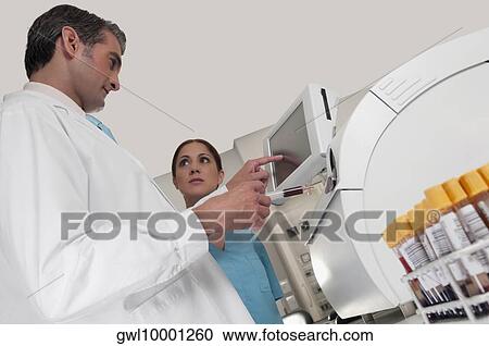 Lab technician testing blood samples in a laboratory View Large Photo Image Stock Image - Lab technician testing blood samples in a laboratory. Fotosearch