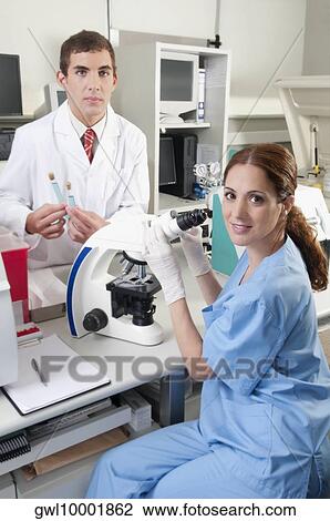 Lab technicians working in a laboratory View Large Photo Image Stock Image - Lab technicians working in a laboratory. Fotosearch