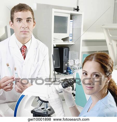 Lab technicians working in a laboratory View Large Photo Image Stock Photo - Lab technicians working in a laboratory. Fotosearch