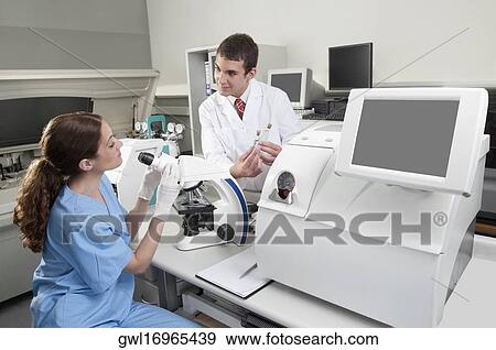 Stock Photo - Lab technicians working in a laboratory. Fotosearch