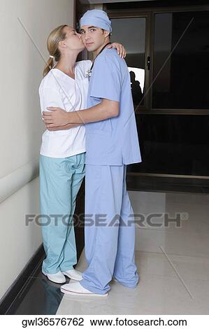 Male and a female nurse romancing in a hospital corridor View Large Photo Image Stock Image - Male and a female nurse romancing in a hospital corridor. Fotosearch