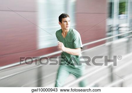 Male nurse running in a hospital View Large Photo Image Stock Image - Male nurse running in a hospital. Fotosearch