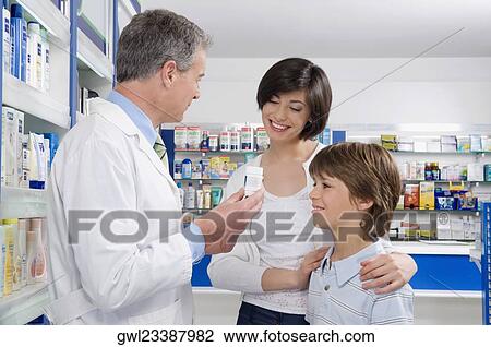 Male pharmacist giving medicine to customers View Large Photo Image Stock Image - Male pharmacist giving medicine to customers. Fotosearch