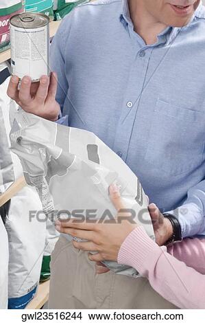 Man and his daughter shopping dog food in a supermarket View Large Photo Image Picture - Man and his daughter shopping dog food in a supermarket. Fotosearch