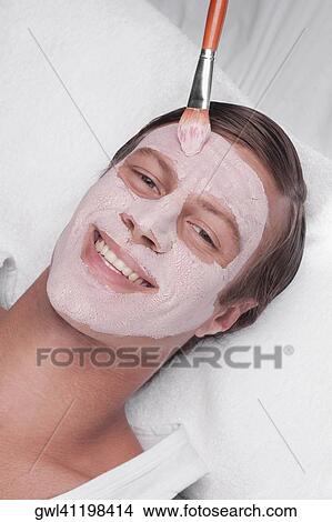 Man applying face pack View Large Photo Image Picture - Man applying face pack. Fotosearch
