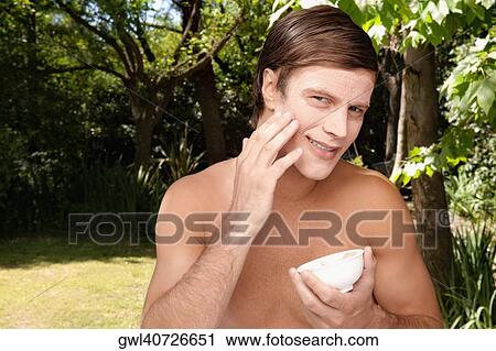 Man applying face pack View Large Photo Image Stock Image - Man applying face pack. Fotosearch