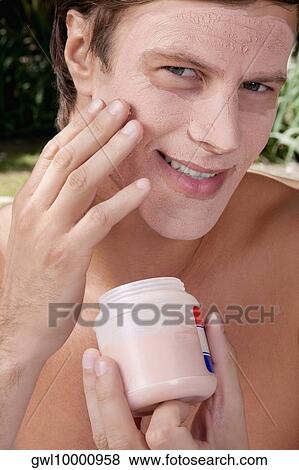 Man applying face pack View Large Photo Image Stock Photo - Man applying face pack. Fotosearch