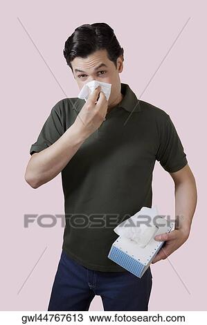 Man blowing his nose View Large Photo Image Stock Image - Man blowing his nose. Fotosearch