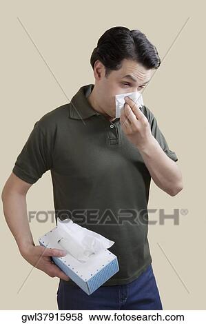 Man blowing his nose View Large Photo Image Stock Photo - Man blowing his nose. Fotosearch