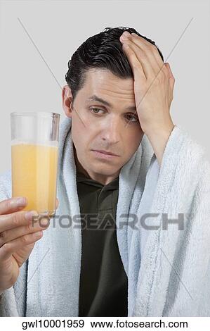 Man drinking orange juice View Large Photo Image Stock Photo - Man drinking orange juice. Fotosearch