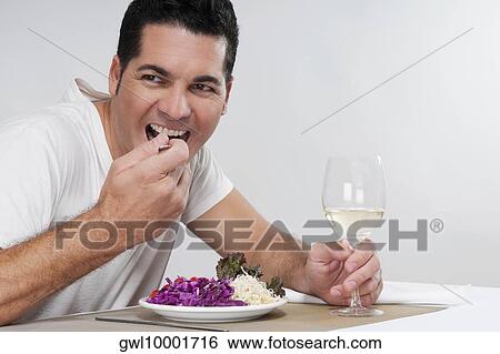 Man eating salad View Large Photo Image Stock Photograph - Man eating salad. Fotosearch