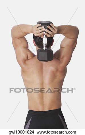 Picture - Man exercising with a dumbbell. Fotosearch