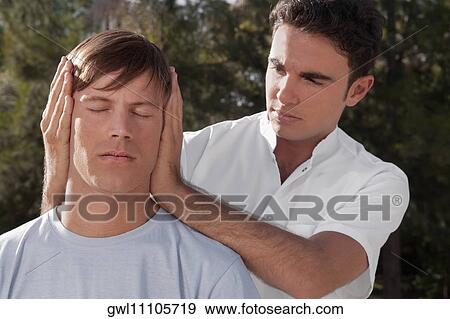 Stock Photo - Man receiving a head massage. Fotosearch