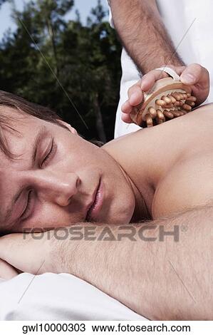 Man receiving acupressure treatment View Large Photo Image Stock Image - Man receiving acupressure treatment. Fotosearch