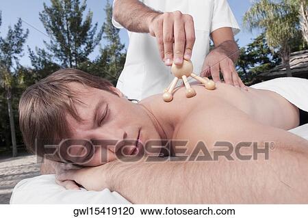 Man receiving acupressure treatment View Large Photo Image Stock Image - Man receiving acupressure treatment. Fotosearch