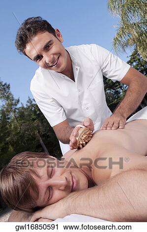 Man receiving acupressure treatment View Large Photo Image Stock Image - Man receiving acupressure treatment. Fotosearch