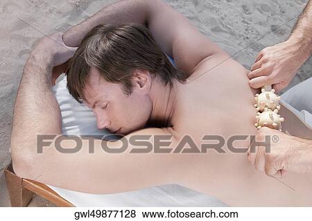 Man receiving acupressure treatment View Large Photo Image Stock Photo - Man receiving acupressure treatment. Fotosearch