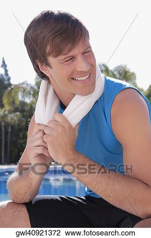Stock Image - Man relaxing after exercise. Fotosearch