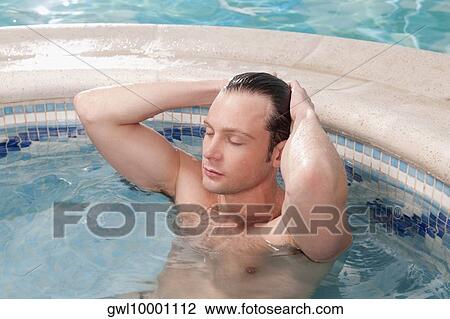 Man relaxing in a hot tub View Large Photo Image Stock Image - Man relaxing in a hot tub. Fotosearch